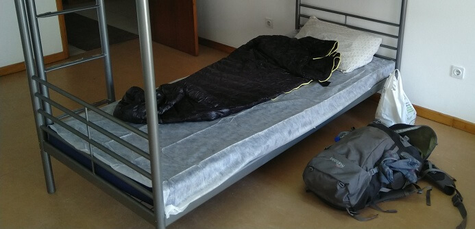 Aegismax sleeping bag on a hostel bed