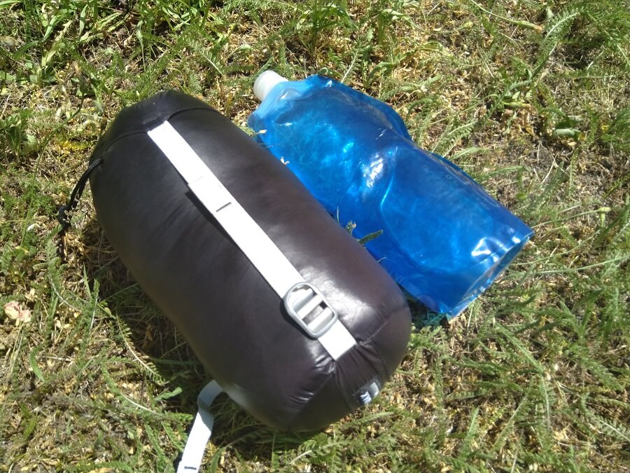 aegismax sleeping bag next to a water bottle