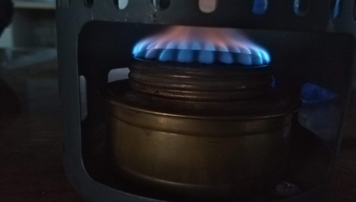 I use this wick alcohol stove. It is super light and allows me to