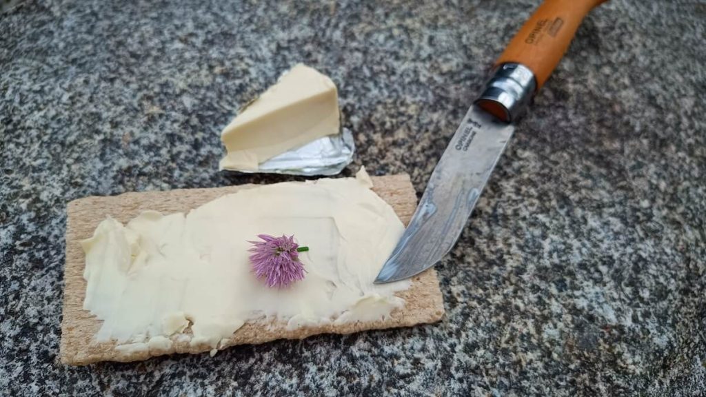 creamcheese-spread-on-cracker-with-opinel-knife